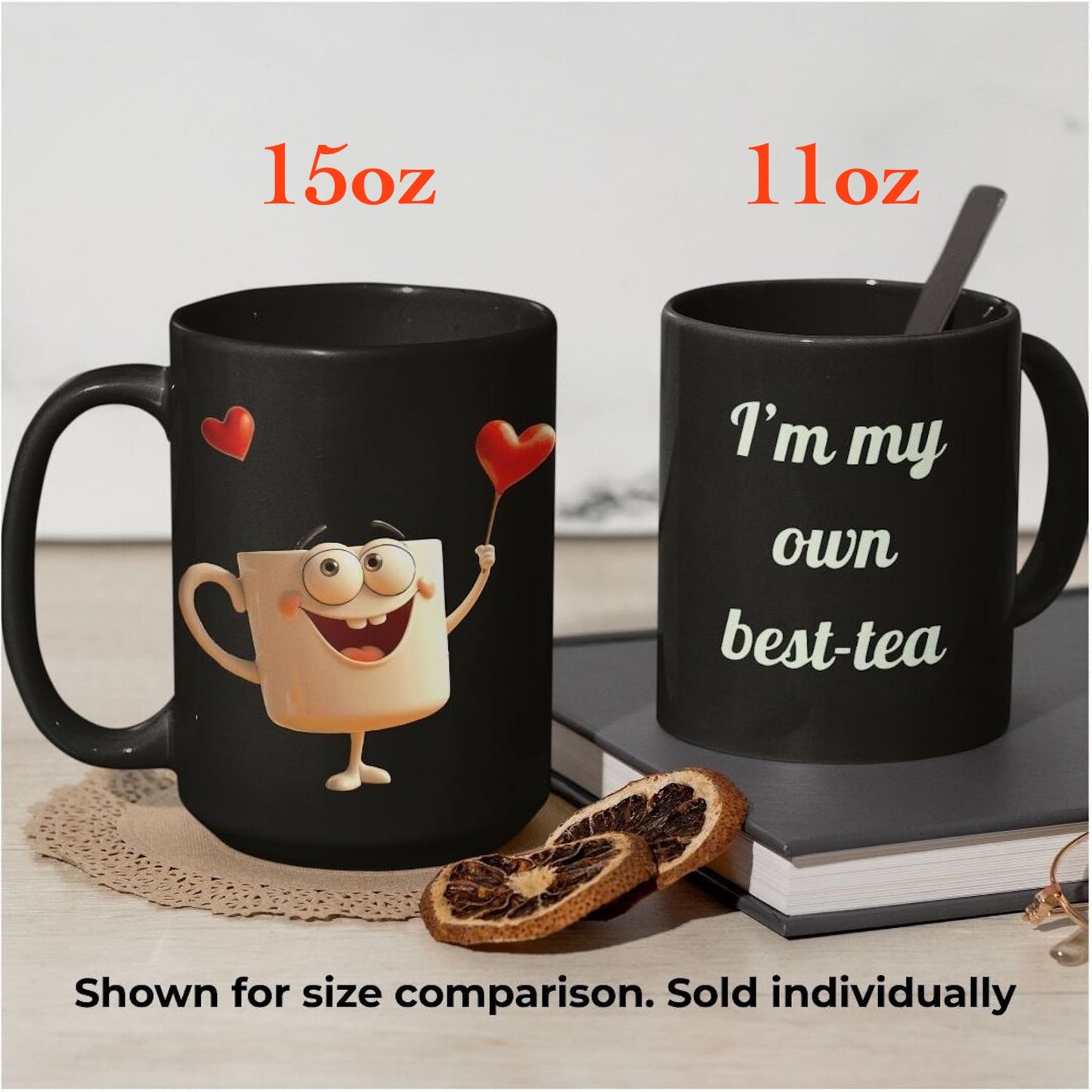 Black ceramic mugs 15oz and 11oz shown side by side for size comparison, with cute design and best-tea quote.