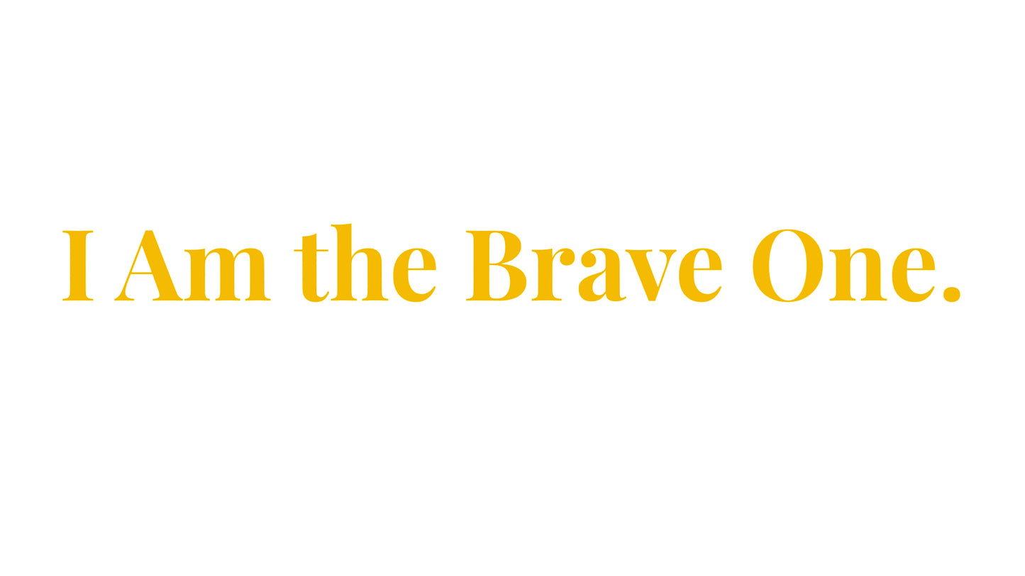 Inspirational quote "I Am the Brave One" in elegant gold font on a solid background, symbolizing courage and self-confidence.