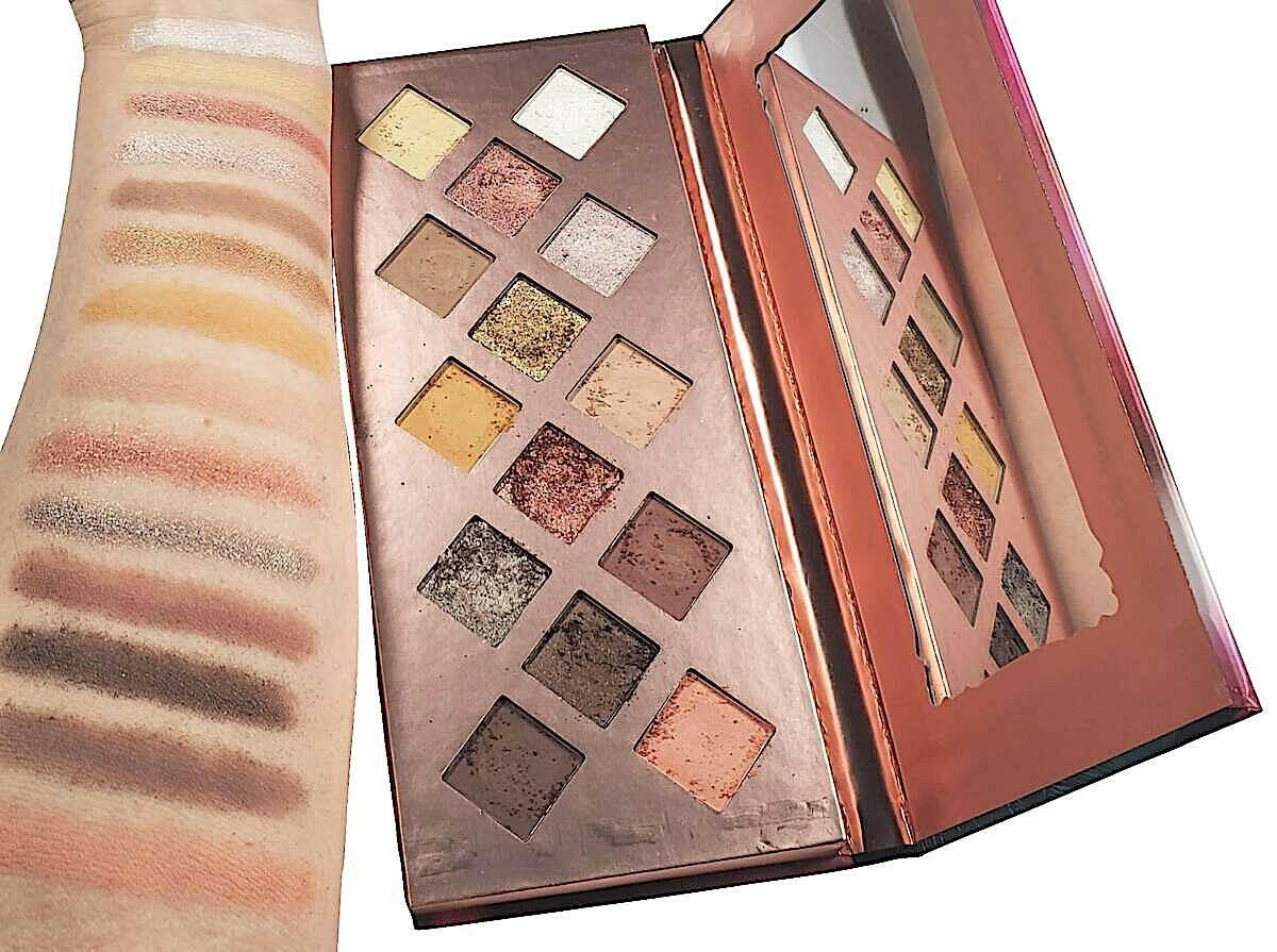 Eyeshadow palette with arm swatches showing vibrant shades.