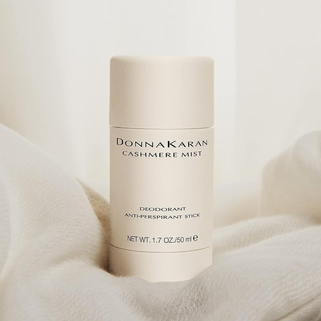 Donna Karan Cashmere Mist Deodorant stick against a soft, neutral background, exuding luxury and subtle elegance.