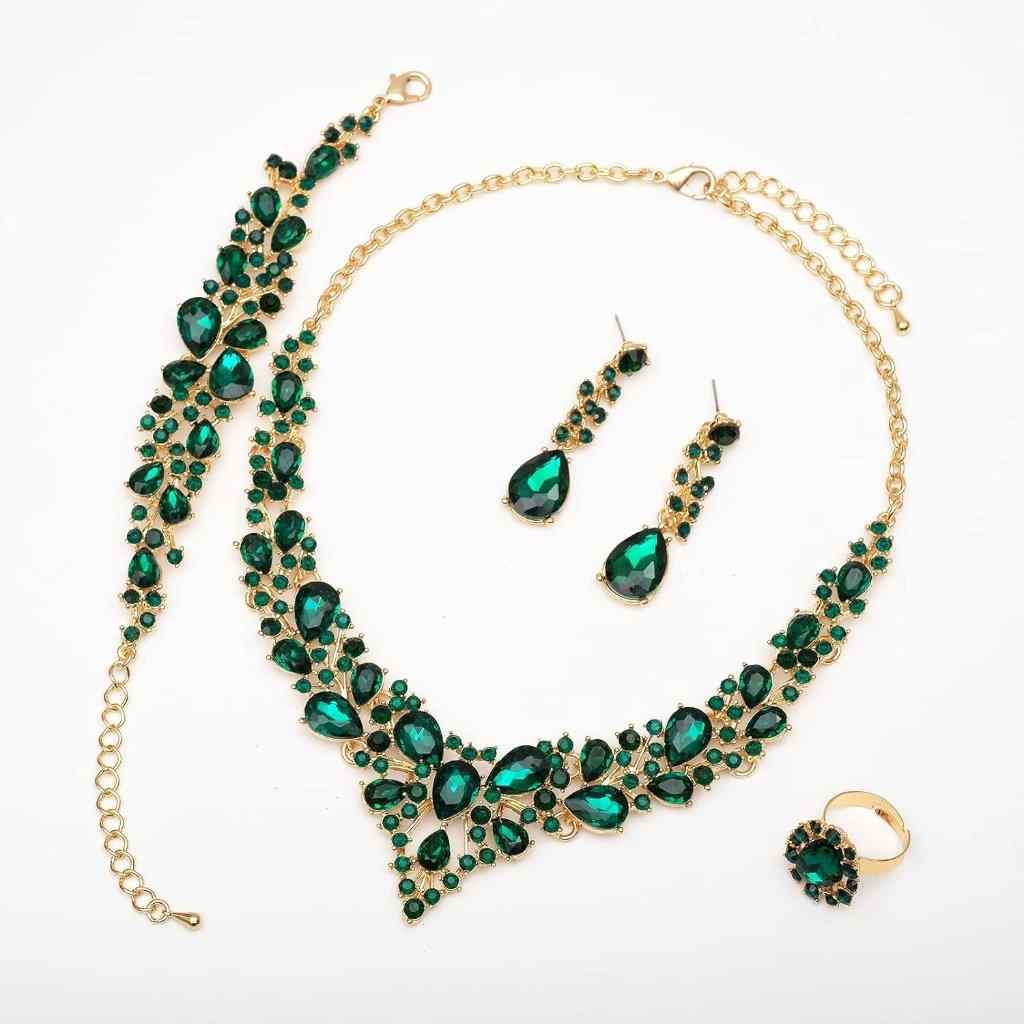 Elegant gold jewelry set with green gemstones: necklace, earrings, bracelet, and ring—perfect for weddings and formal events.