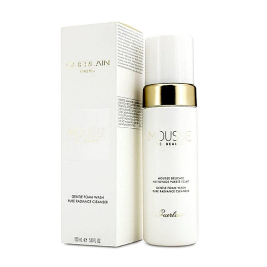 Guerlain Mousse de Beauté Gentle Foam Wash, 150ml, in an elegant white bottle with a gold cap next to its packaging box.
