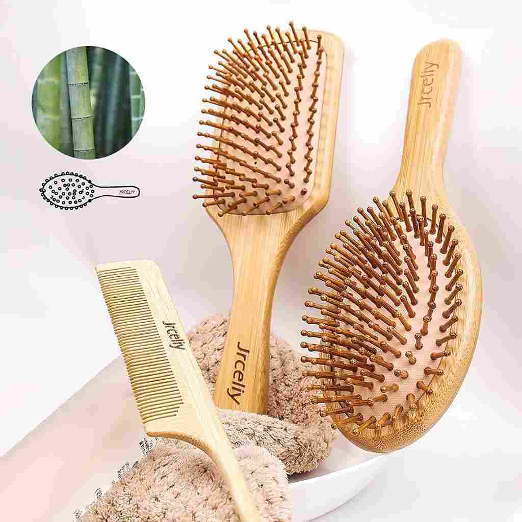 Jrceliy bamboo hair brush set with paddle brush, oval brush, and comb, eco-friendly design for gentle hair care on soft towel.