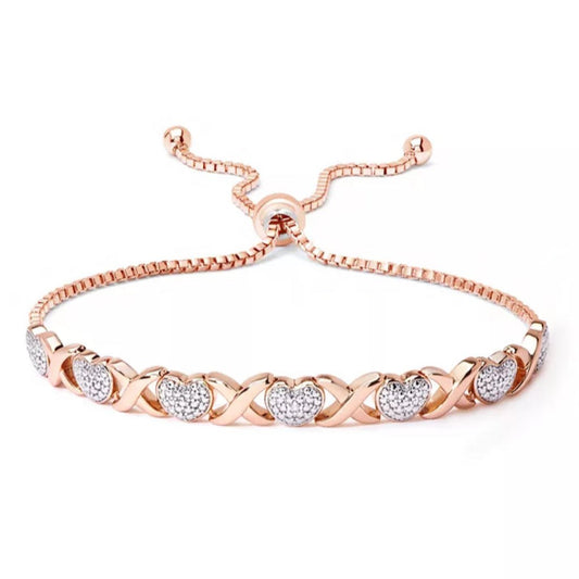 Elegant rose gold bracelet with sparkling heart and infinity symbols, featuring adjustable chain for a stylish, personalized fit.