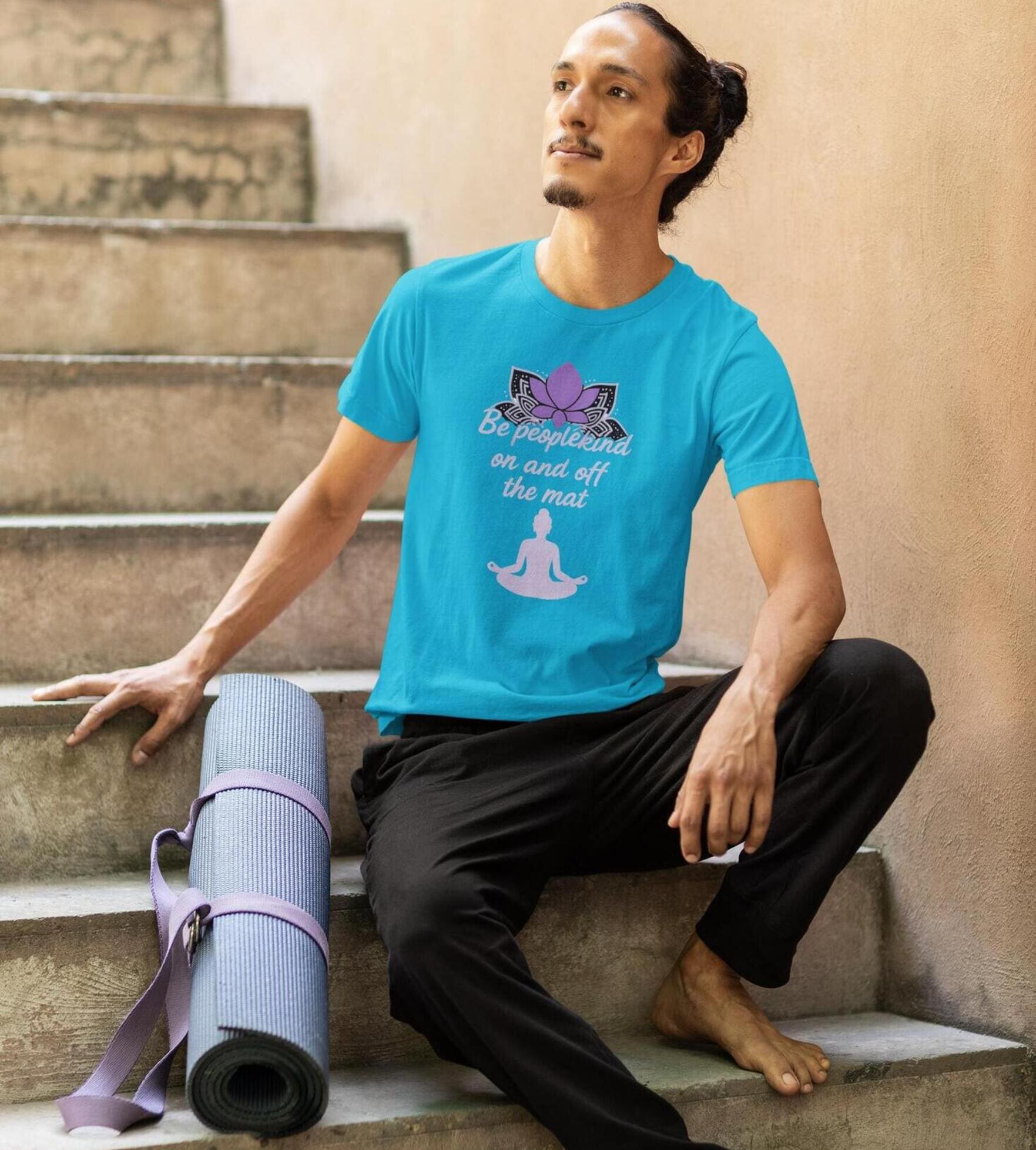 Turquoise unisex yoga t-shirt with Be Peoplekind on and off the mat quote and lotus graphic for mindful lifestyle