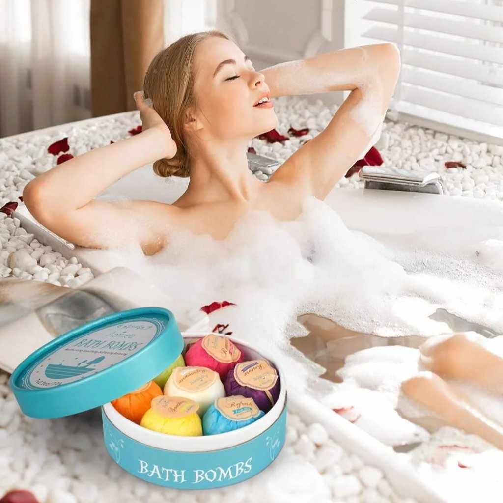 Woman relaxing in a bubble bath with colorful bath bombs nearby, enjoying luxurious self-care and a calming spa-like experience.