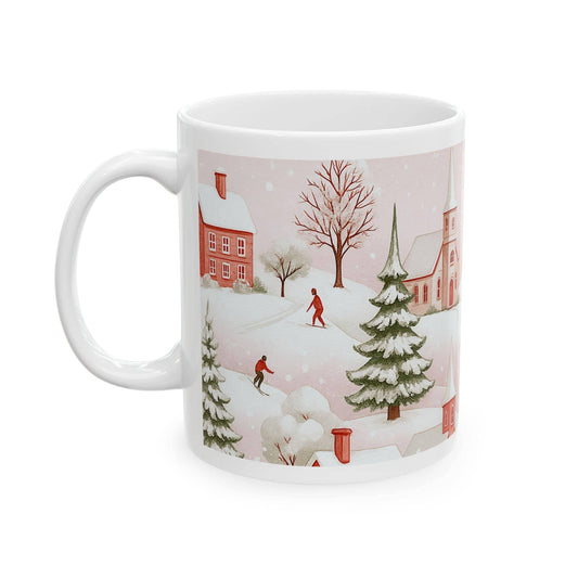 White ceramic mug with pink winter village scene, skiers, snow-covered trees, and festive houses.