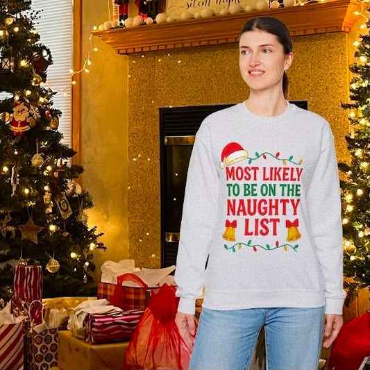 Woman wearing ash color Christmas sweatshirt with "Most Likely to Be on the Naughty List" design, festive holiday outfit.