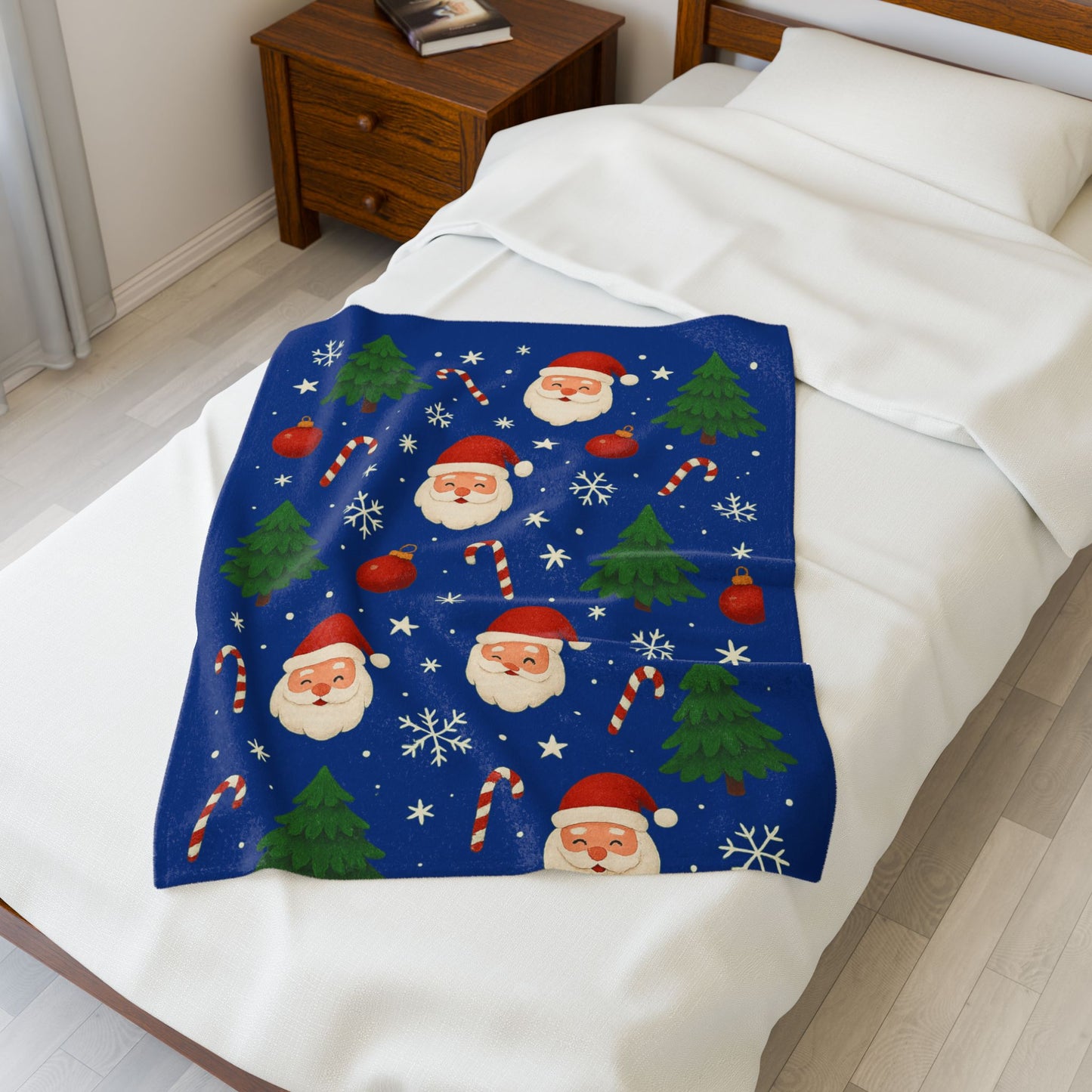 Cozy Christmas 30x40 velveteen plush blanket featuring Santa Claus, Christmas trees, snowflakes, and candy canes on a blue background.