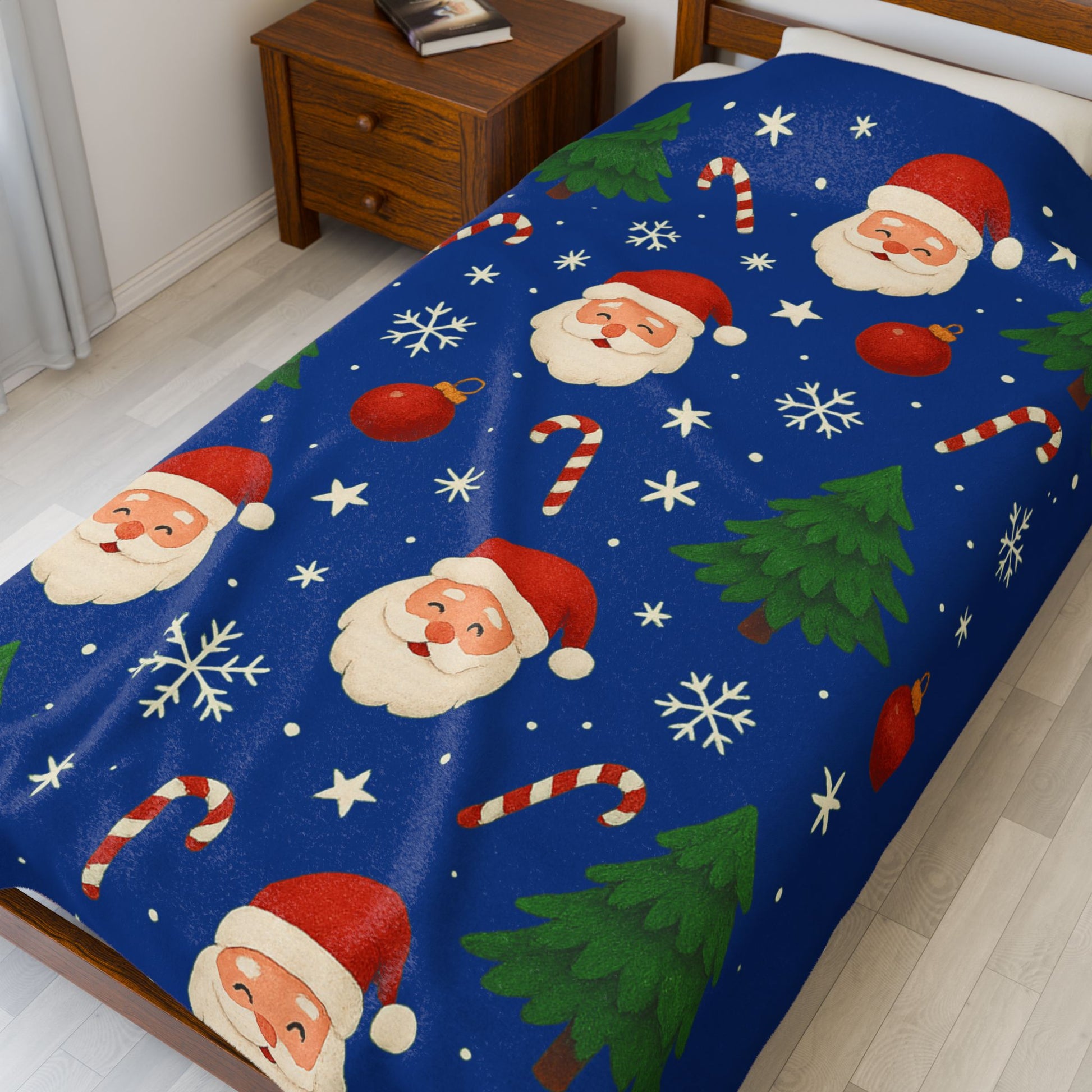 Large 60x80 cozy Christmas plush blanket with Santa Claus print, green trees, red ornaments, and snowflakes on a blue background.