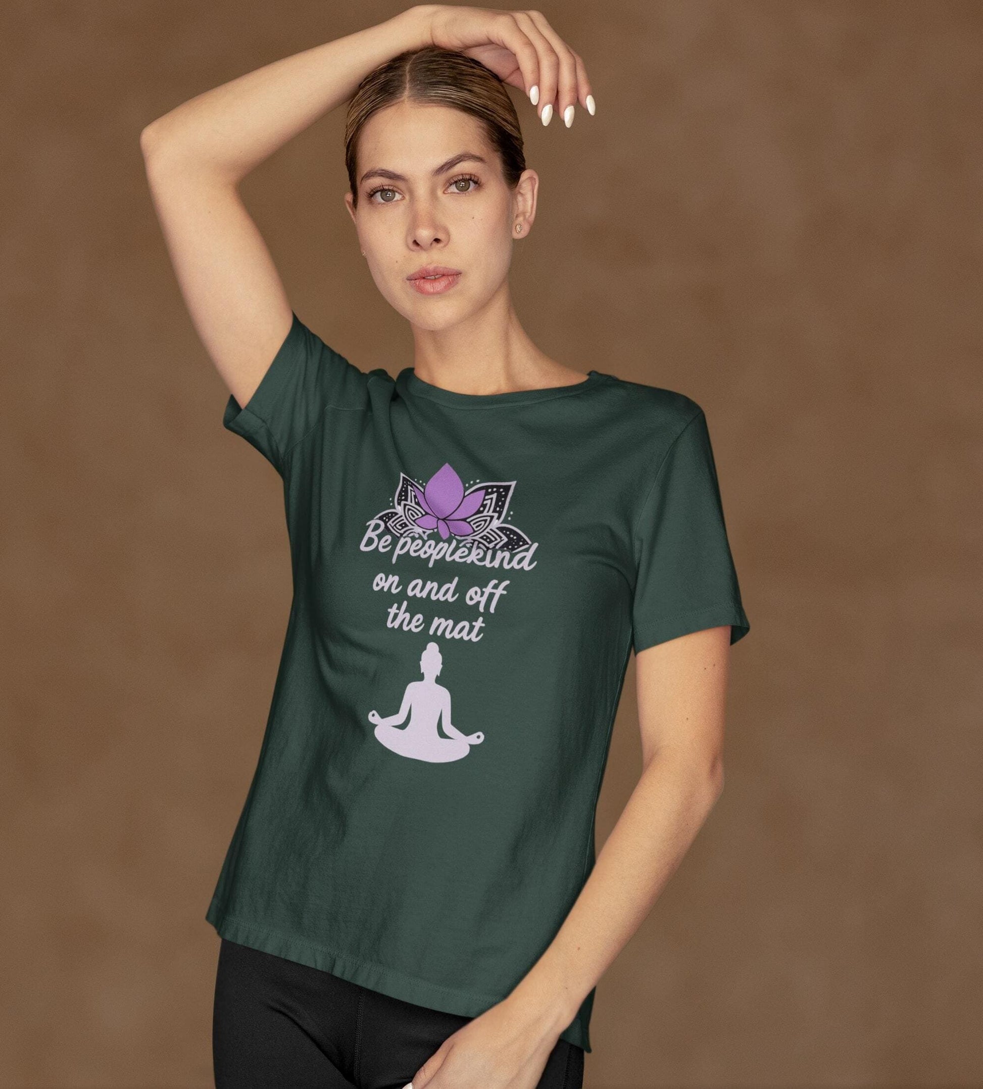 Forest green Bella Canvas 3001 t-shirt with lotus and yoga quote "Be peoplekind on and off the mat" worn by woman in pose
