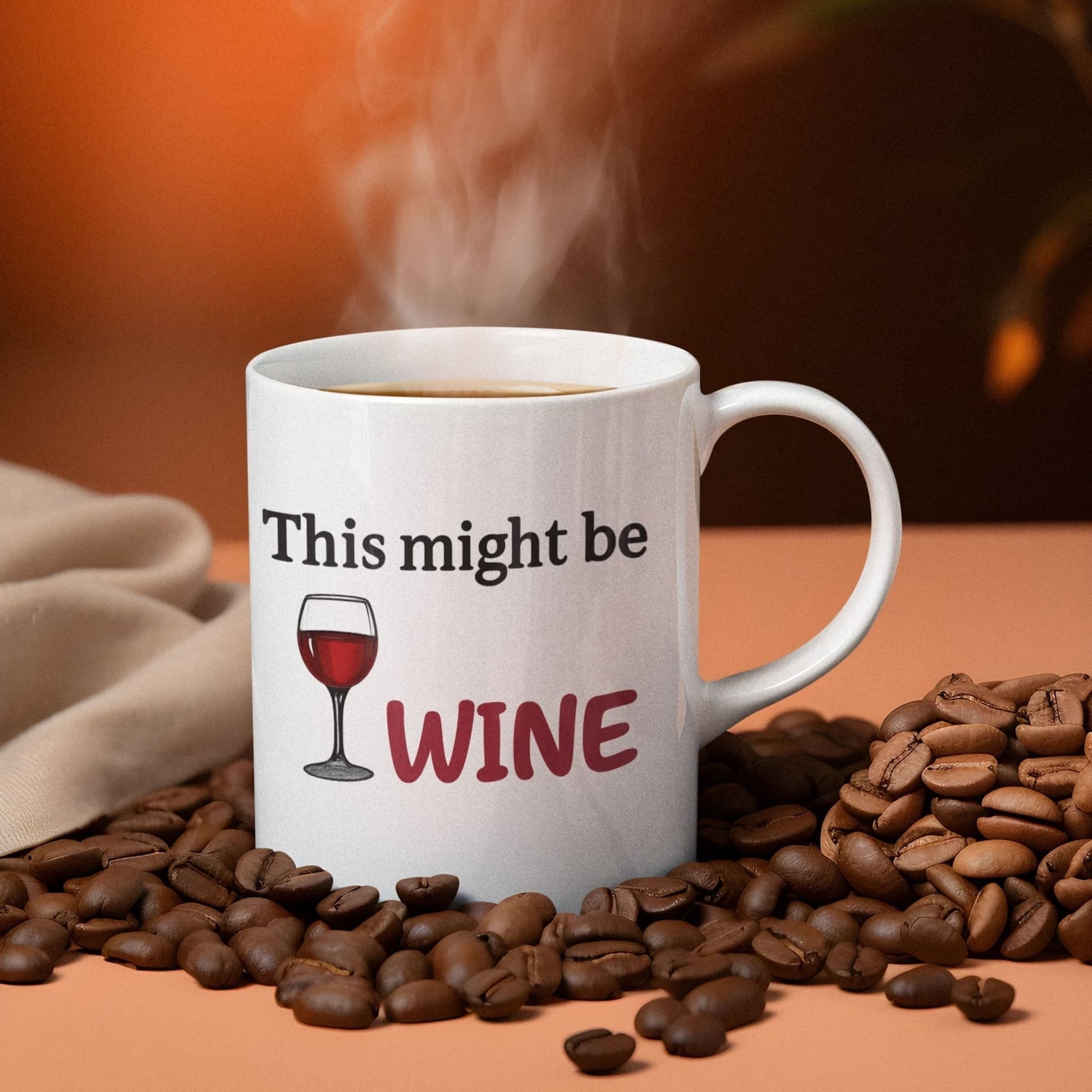 Funny 11oz mug that says "This might be WINE" surrounded by coffee beans with hot steam rising from the drink