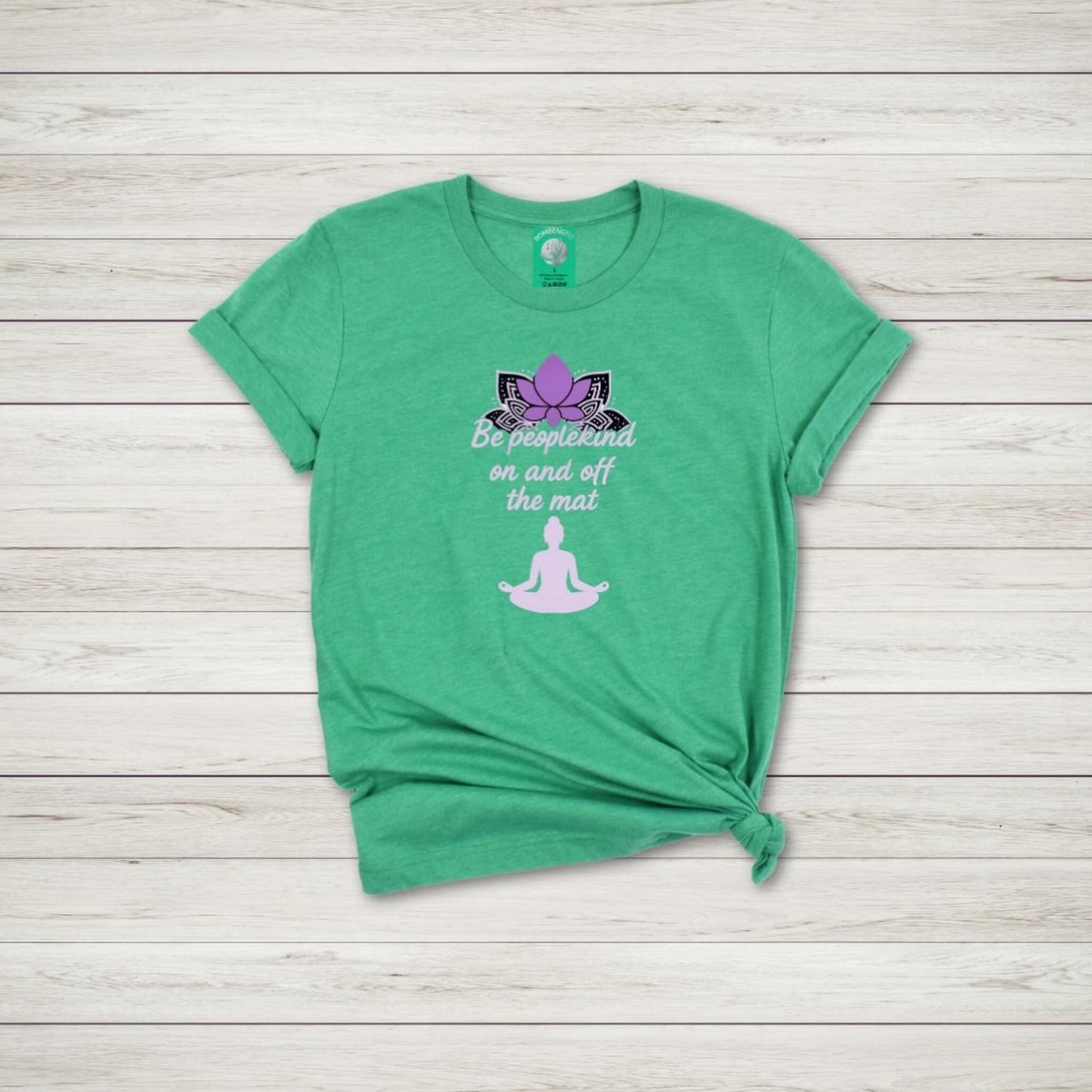 Heather Kelly Bella Canvas 3001 yoga t-shirt with lotus flower and quote Be peoplekind on and off the mat in purple ink