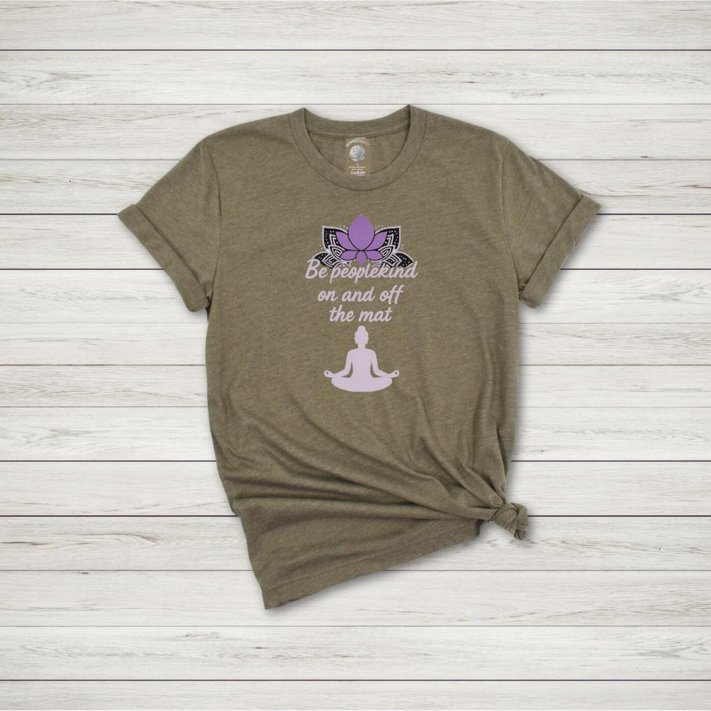 Heather Olive yoga shirt with purple lotus and quote "Be peoplekind on and off the mat" plus meditating figure in soft pink