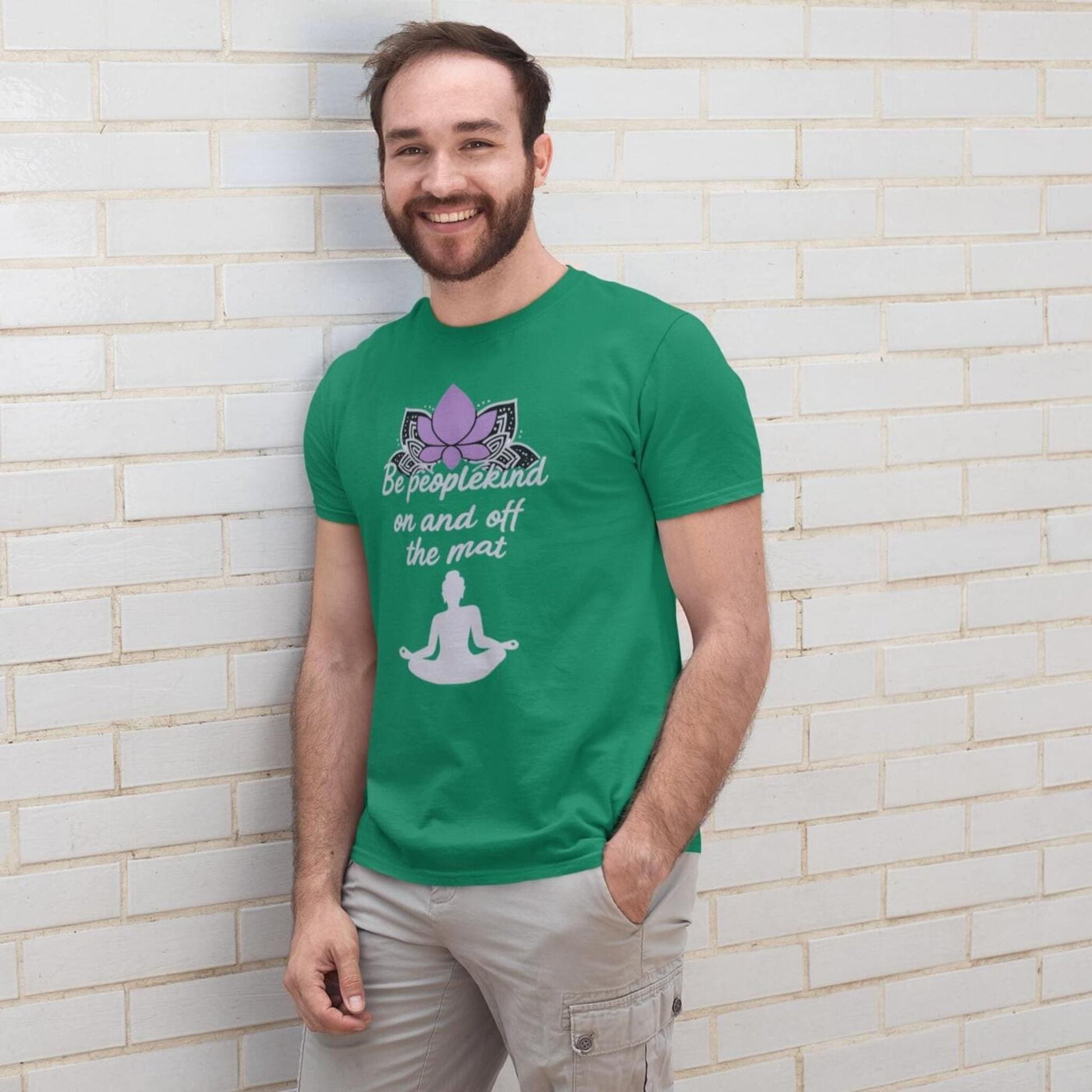 Kelly green Bella Canvas 3001 yoga t-shirt with Be peoplekind on and off the mat quote, modeled by smiling man outdoors