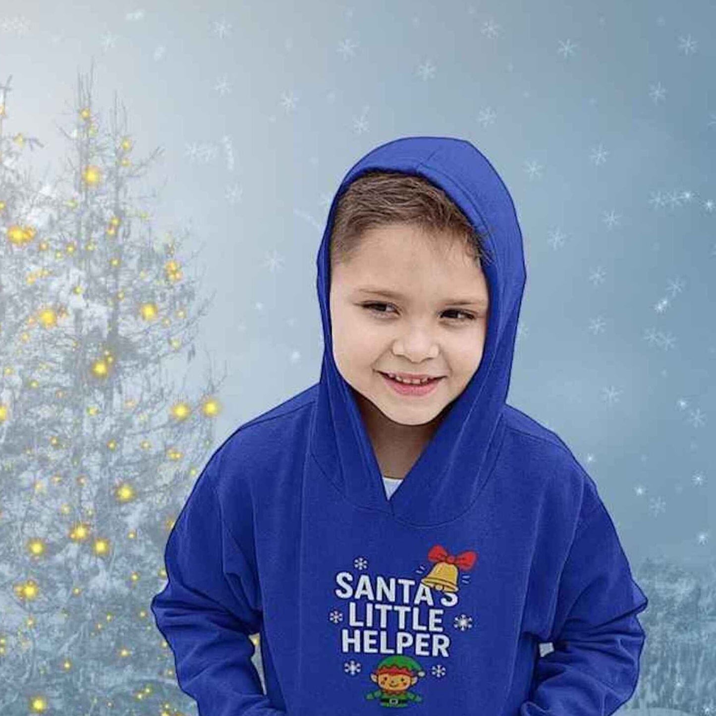 Boy wearing royal blue hoodie with Santa’s Little Helper design, featuring elf, bell, and snowflakes, festive Christmas outfit.