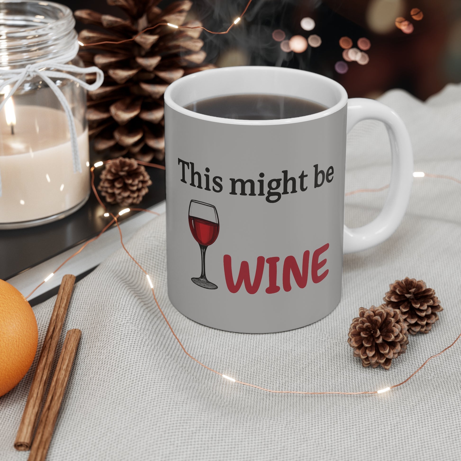 Funny wine mug gift idea – “This might be wine” printed cup in winter holiday decor with warm lights