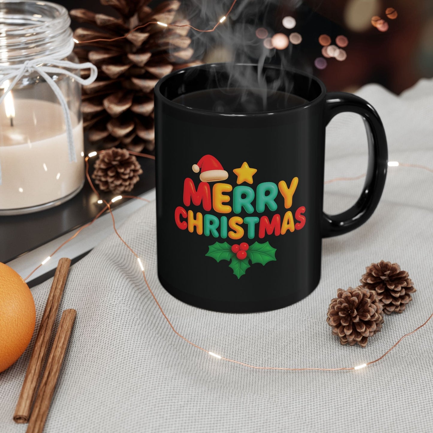 Black ceramic mug with colorful "Merry Christmas" design, Santa hat, holly, and festive decor like pinecones, candle, and lights.