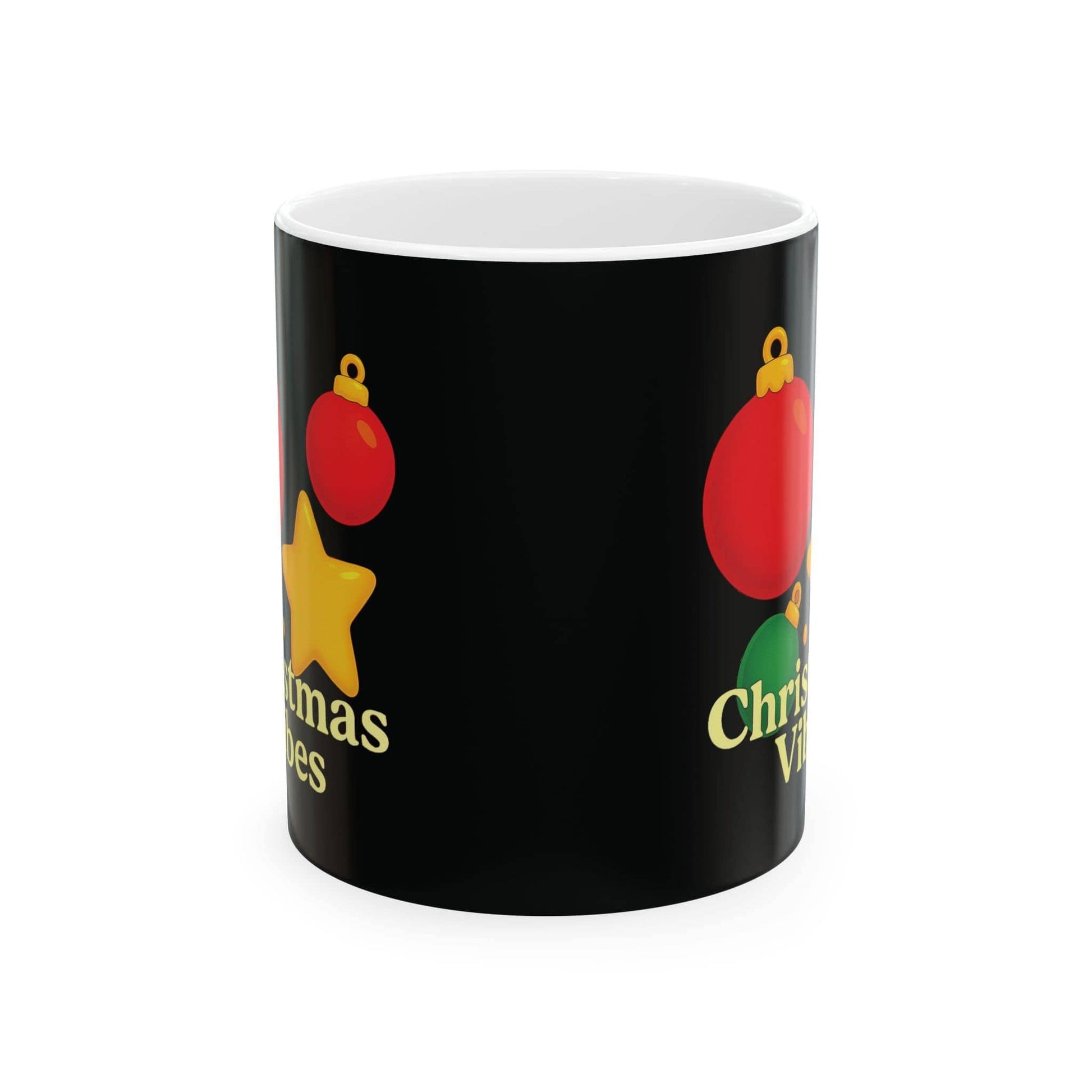 Side view of black ceramic Christmas mug with festive red, green, and yellow ornaments and partial “Christmas Vibes” text.

