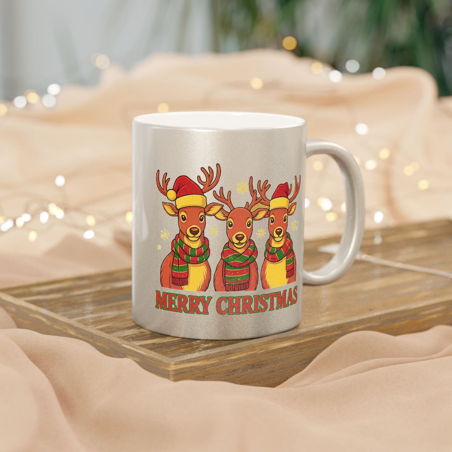 Silver Christmas mug with three reindeer in Santa hats and scarves, with 'Merry Christmas' text and festive lights.