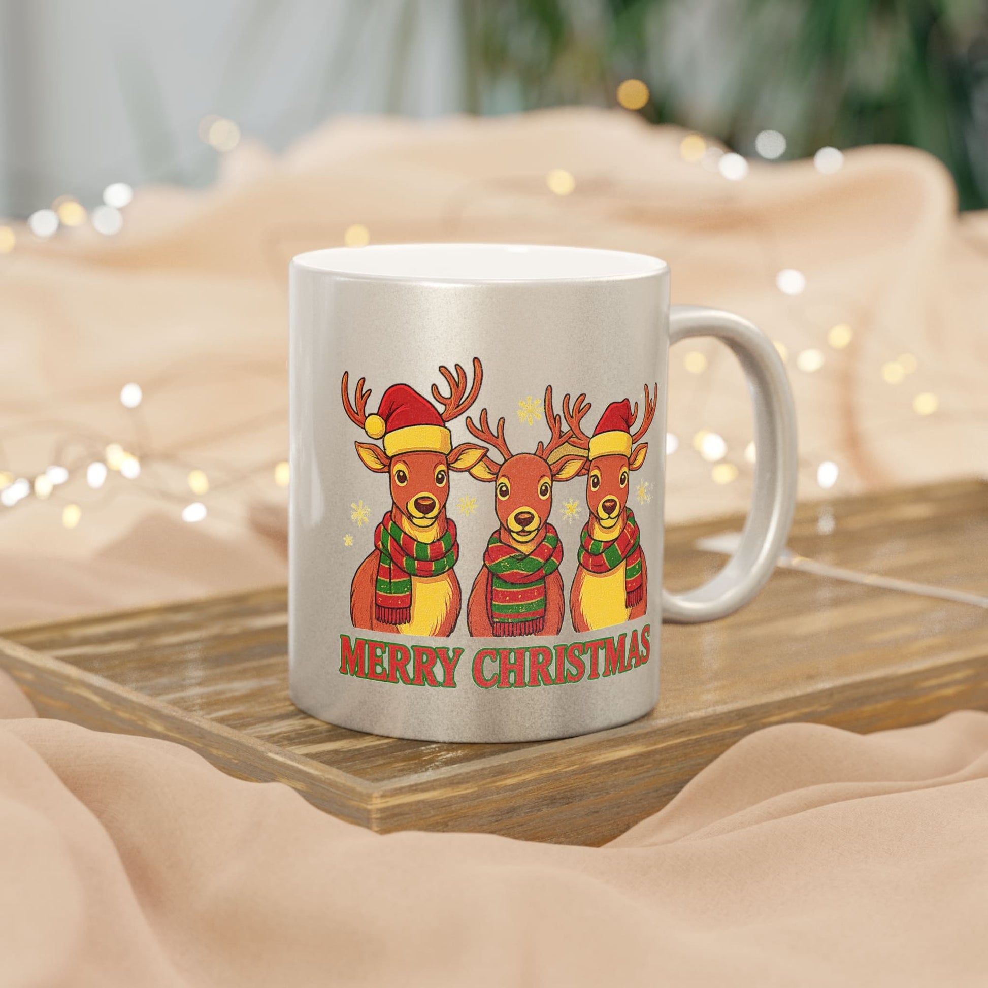 Silver Christmas mug with three reindeer in Santa hats and scarves, with 'Merry Christmas' text and festive lights.